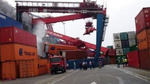 Gallery: Fire Erupts After Boxship Hits Gantry Crane in Port Said
