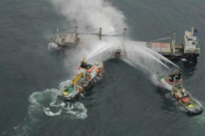 Gallery: Firefighters to Flood Cargo Holds of Freighter Ablaze off Germany