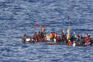 US Navy Ship Plucks 65 from Bamboo Rafts off Indonesia